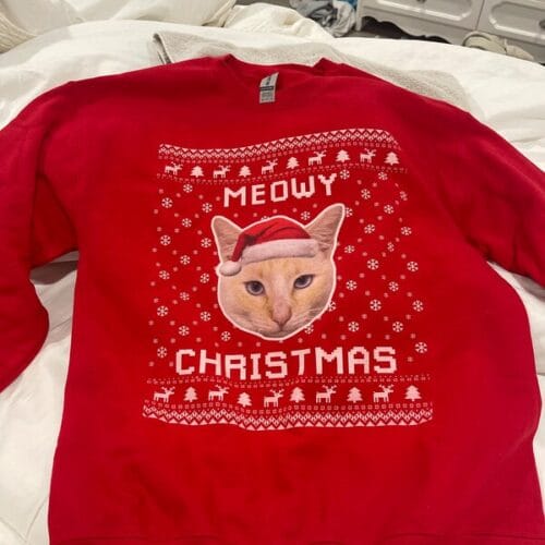 Red Color Ugly Christmas Sweater with Cat's photo on it and text Meowy Christmas below it