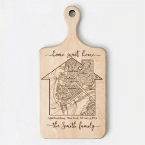 Personalized maple wood cutting board engraved with a custom house map, address, and the family name - perfect for realtor closing gifts or new homeowners.